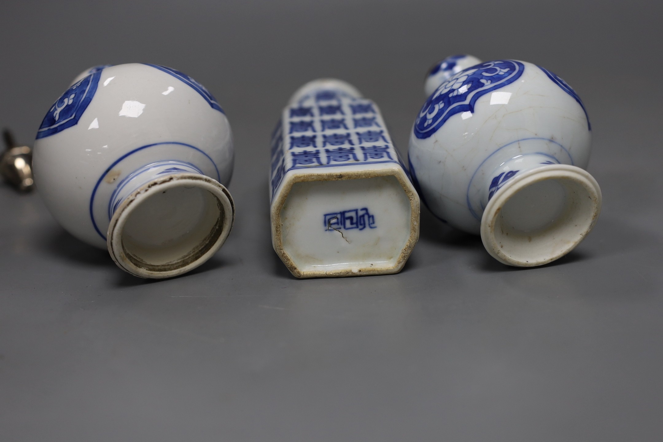 A pair of Chinese Kangxi blue and white rose water sprinklers (cut down) and an unusual 19th century Chinese blue and white ‘Hundred Shou’ jar, rose sprinklers: 10cms high excluding metal tops